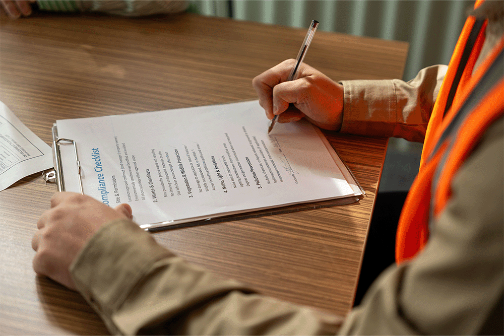person completing a survey at a desk